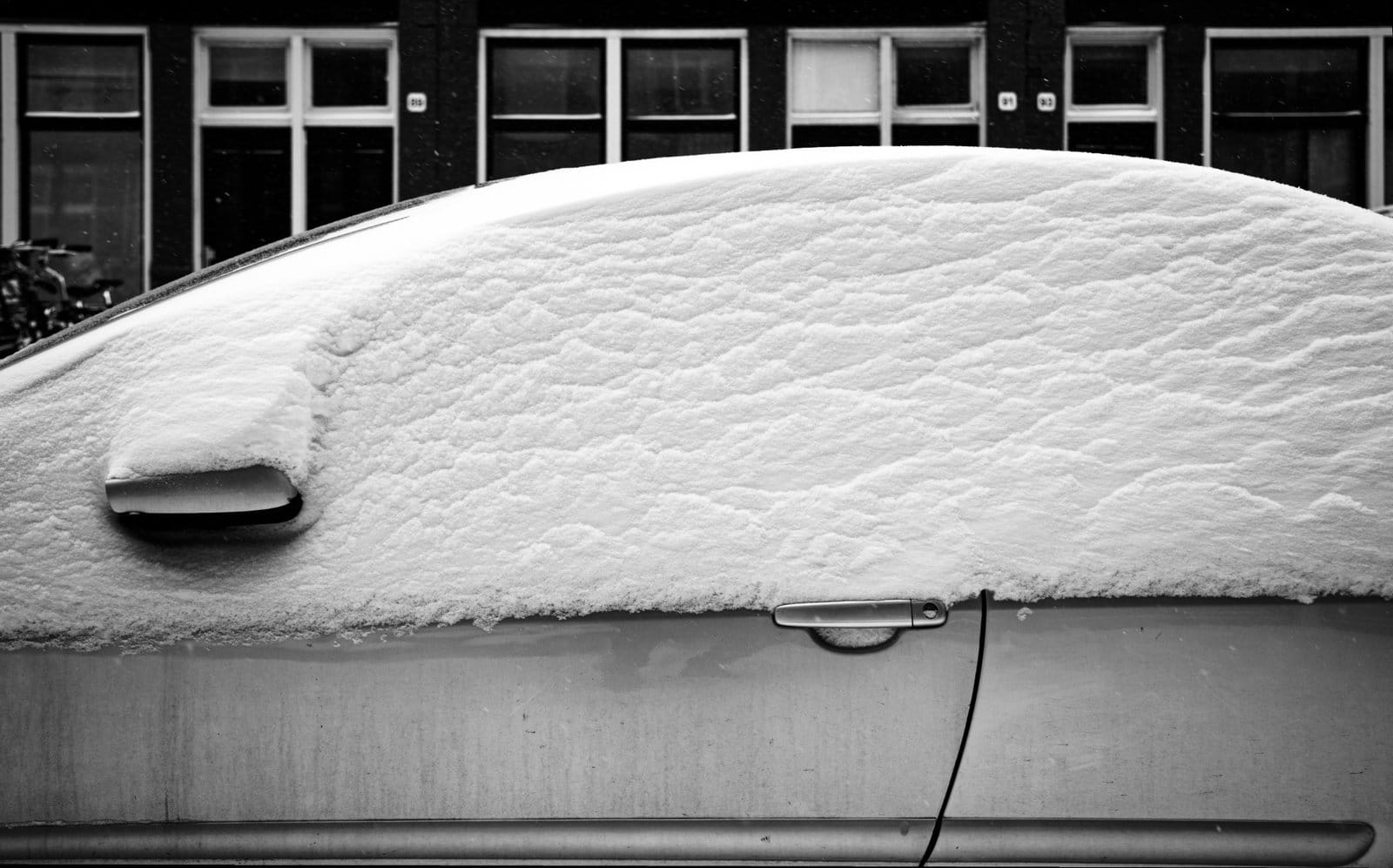 A car covered with snow in February 2021, Amsterdam