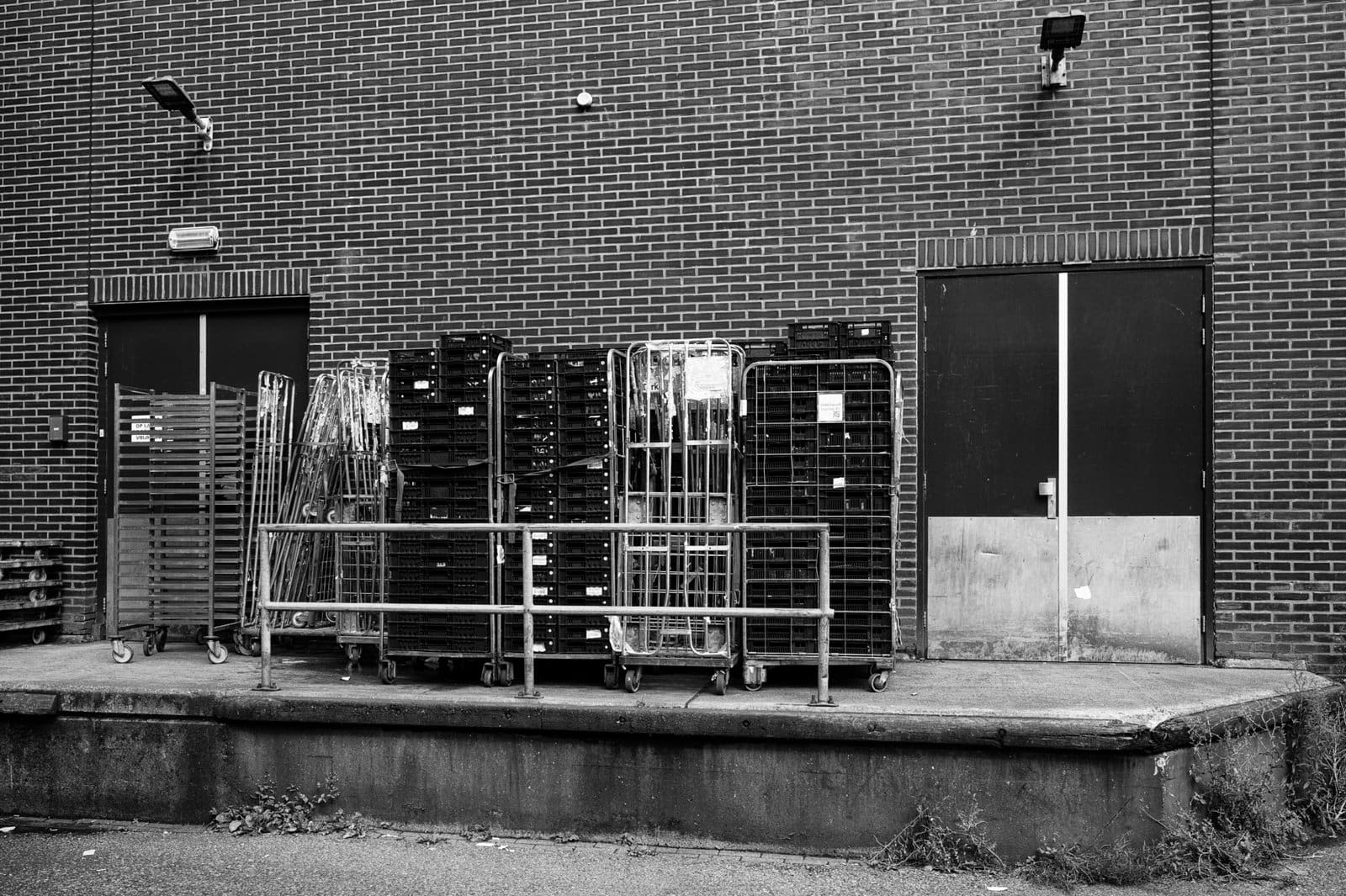 Crates and carts at the back of a supermarket in Amsterdam, 2023